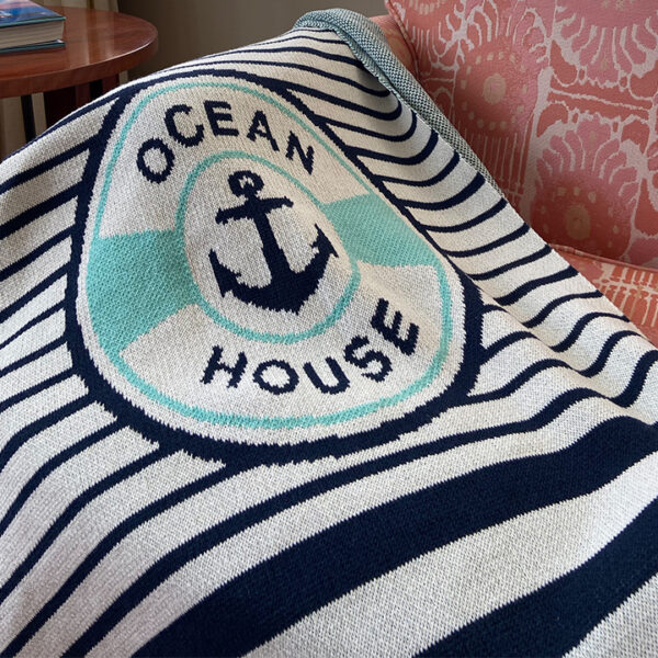 An eco throw that says "Ocean House".